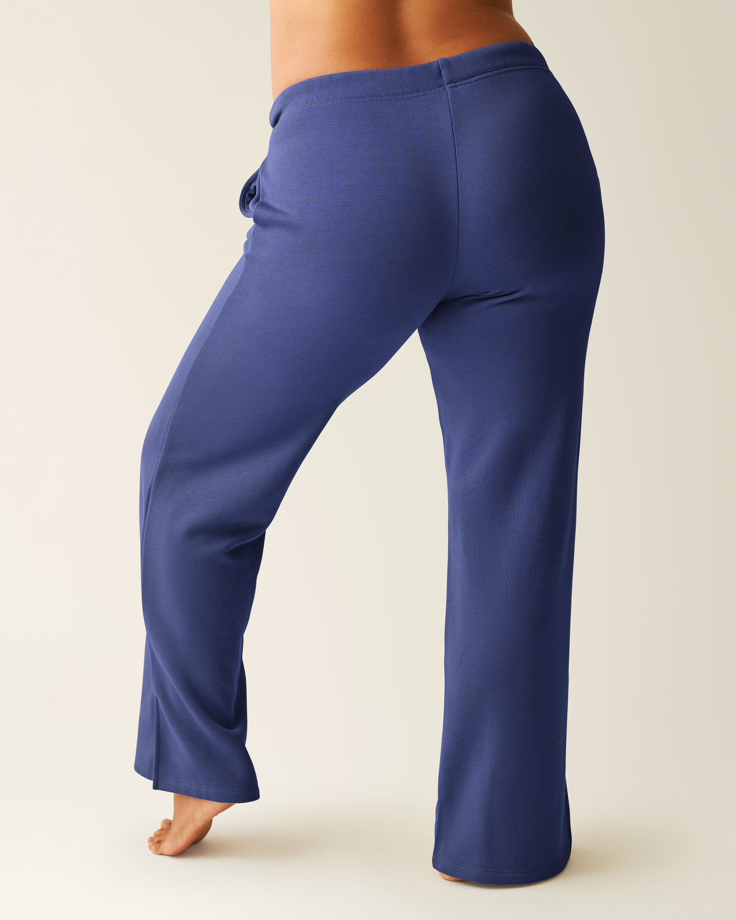 Back of woman wearing the Ribbed Bamboo Long Sleeve Nursing T-shirt with matching Cloud Fleece Sweatpant in Deep Blue