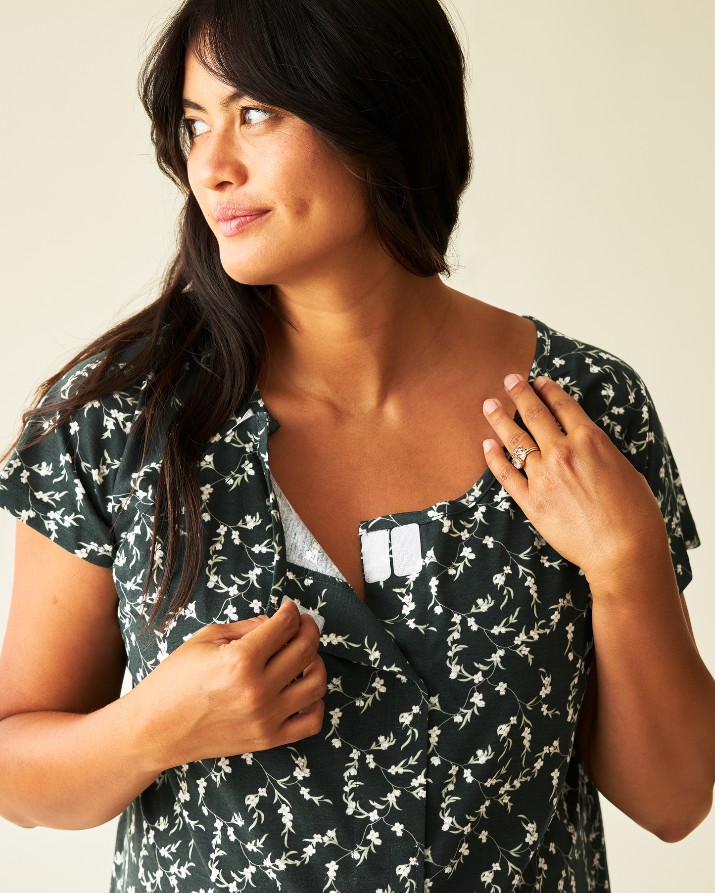 Model showing features on Universal Labor & Delivery Gown in Evergreen Blossom