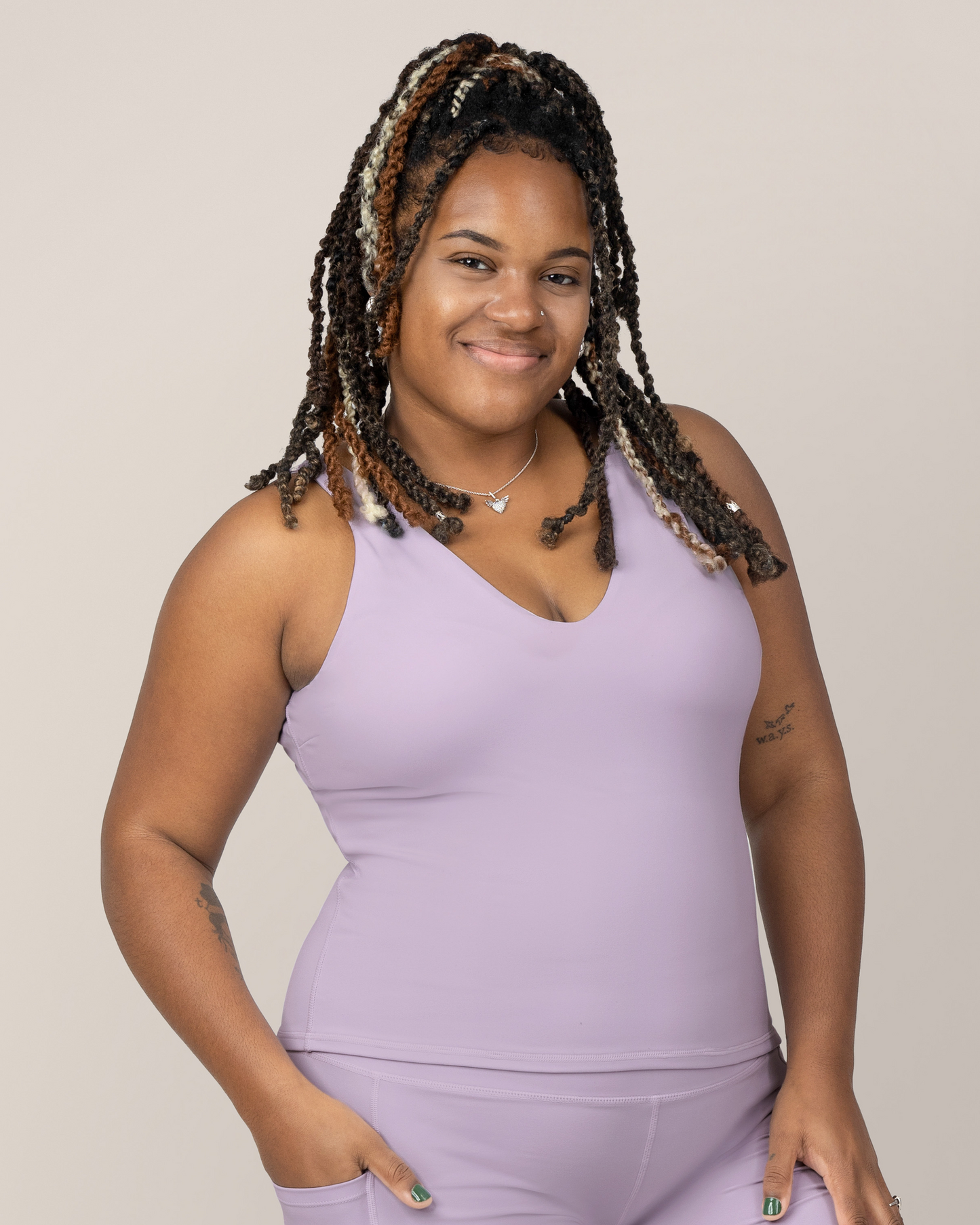 Front view of Model wearing the Wren Active V-neck Nursing Tank Top in Lavender Mist @model_info:Tonia is wearing a Large.