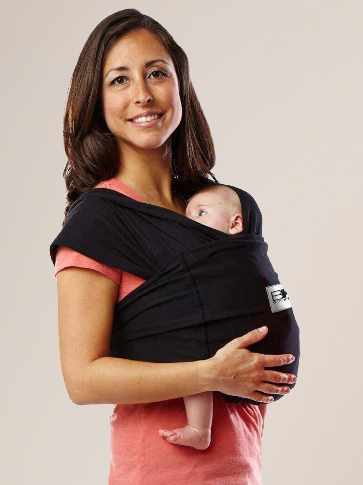 Model wearing baby in the Baby K'tan Original Baby Carrier in Black