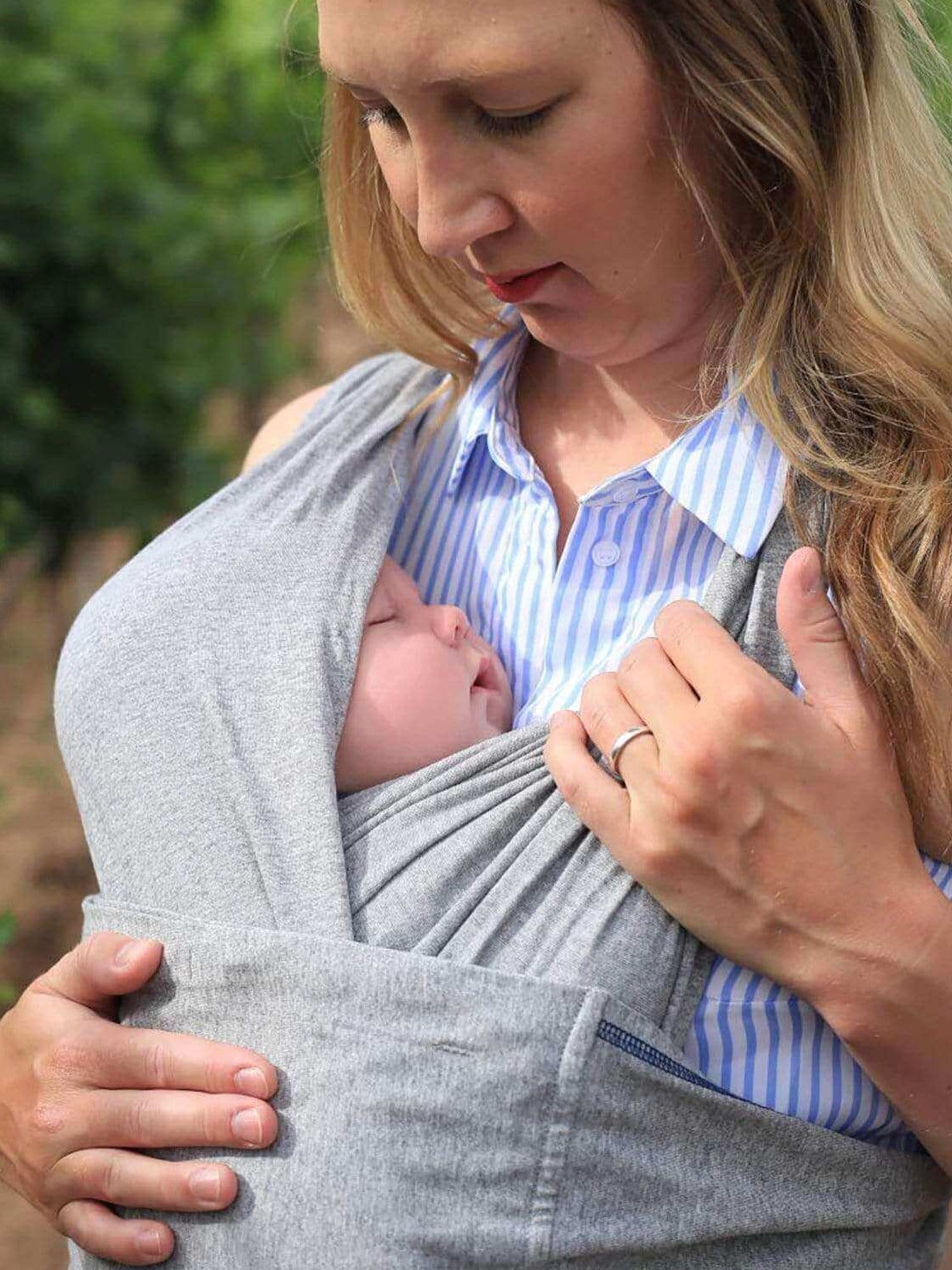 Model wearing baby in the Baby K'tan Original Baby Carrier in Heather Grey