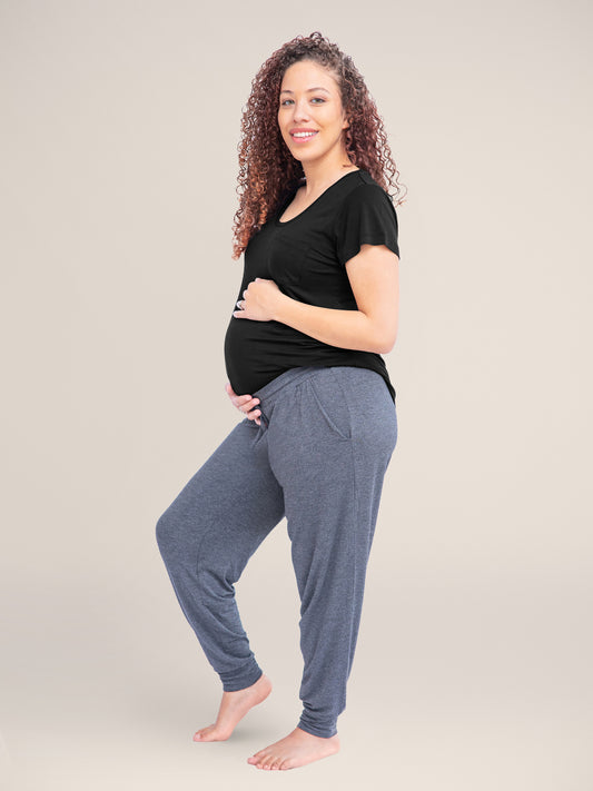 Model wearing the Everyday Lounge Jogger in Grey Heather holding her baby bump @model_info:Gabrielle is 5'6" and wearing a Medium Regular.