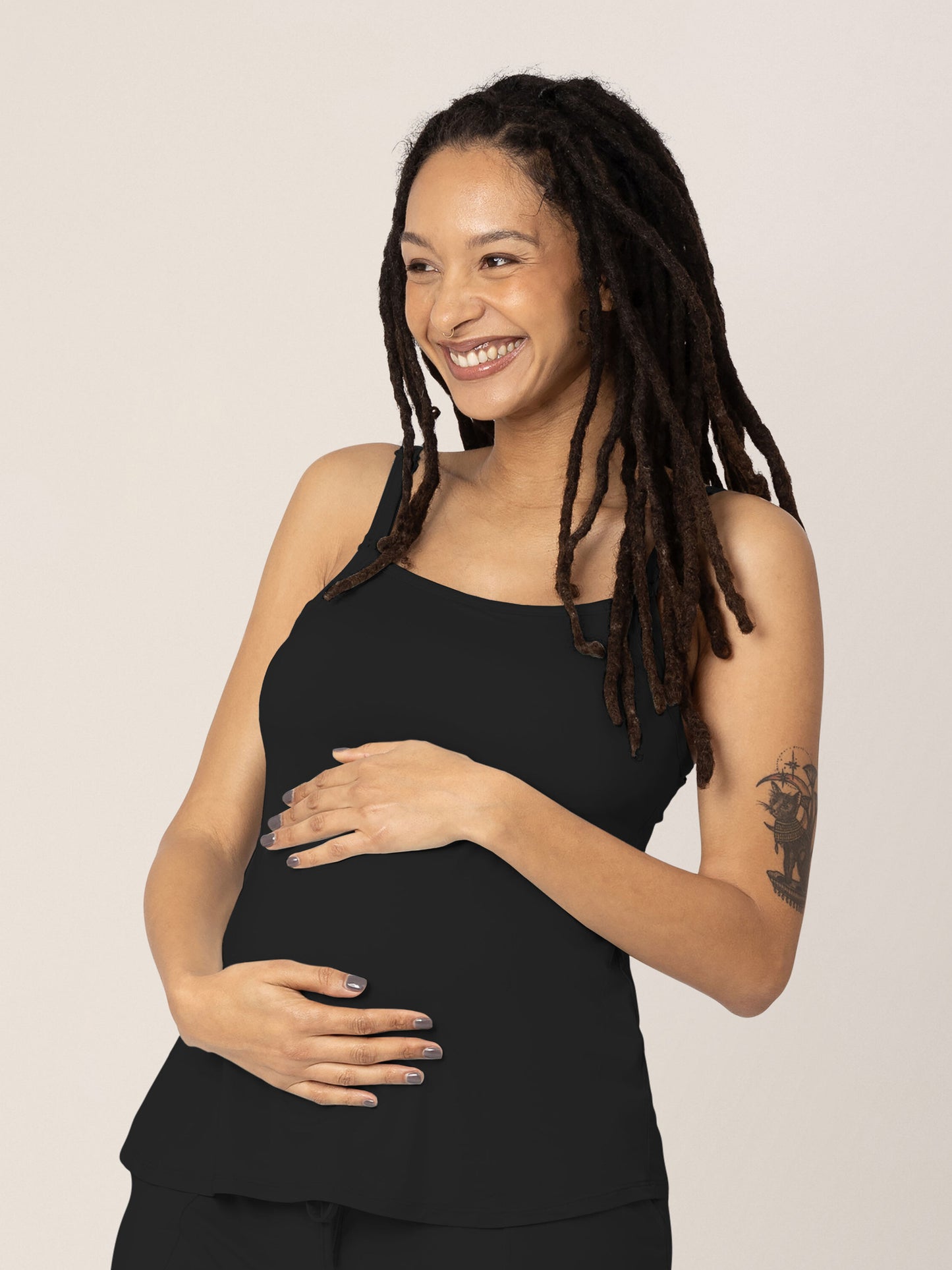 Pregnant model wearing the Bamboo Lounge Around Nursing Tank in Black. @model_info:Chrissy is wearing a Small.