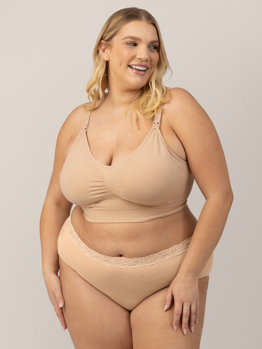 Model wearing the Simply Sublime® Nursing Bra in Beige with her hands on her legs. @model_info:Lauren is wearing an X-Large Busty.