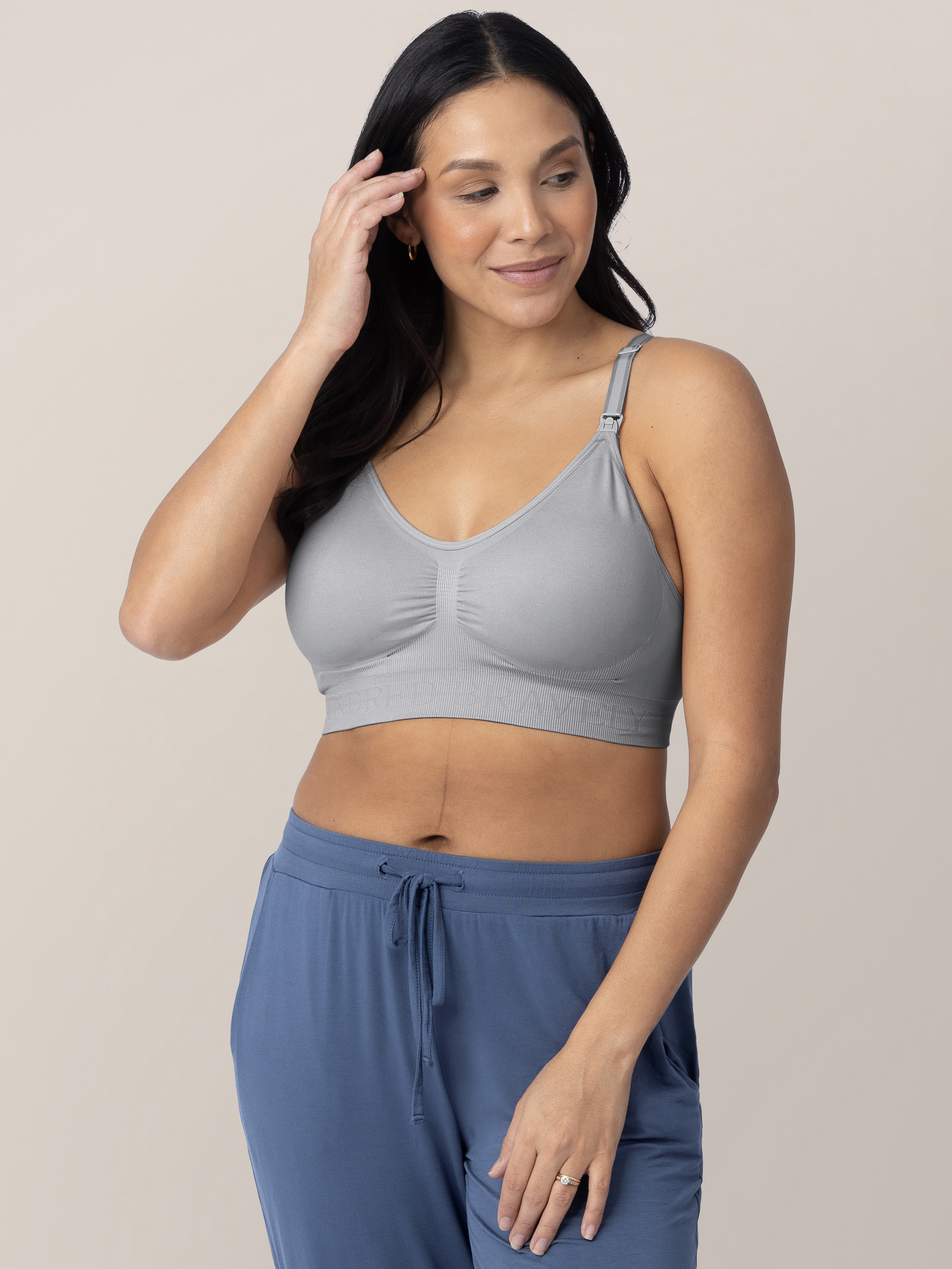 Model wearing the Simply Sublime® Nursing Bra in Grey with her hand on her head and on her thigh. @model_info:Julana is wearing a Small.