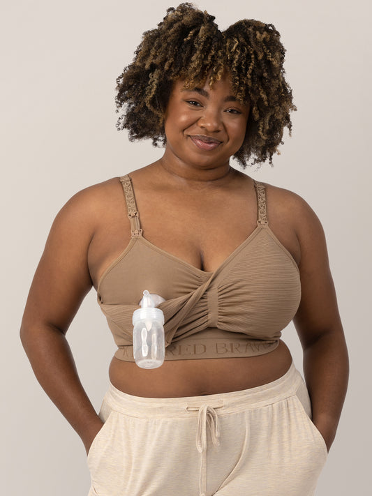 Model wearing the Sublime® Hands-Free Pumping & Nursing Bra in Latte, demonstrating the clip down nursing and pumping access @model_info:Skye is wearing an X-Large Busty.