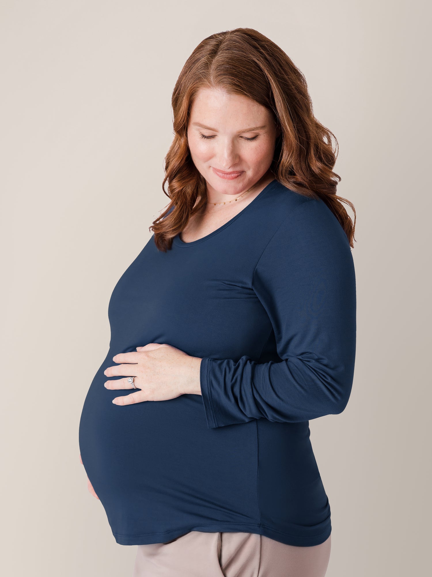 Pregnant model wearing the Bamboo Maternity & Nursing Long Sleeve T-shirt in Navy @model_info:Amy is wearing a Large.