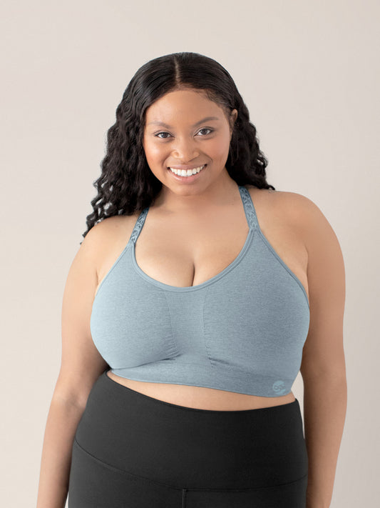 Model smiling into the camera wearing the Diana Sublime® Sports Bra in Seaglass Heather @model_info:Alexis is wearing an X-Large Busty.
