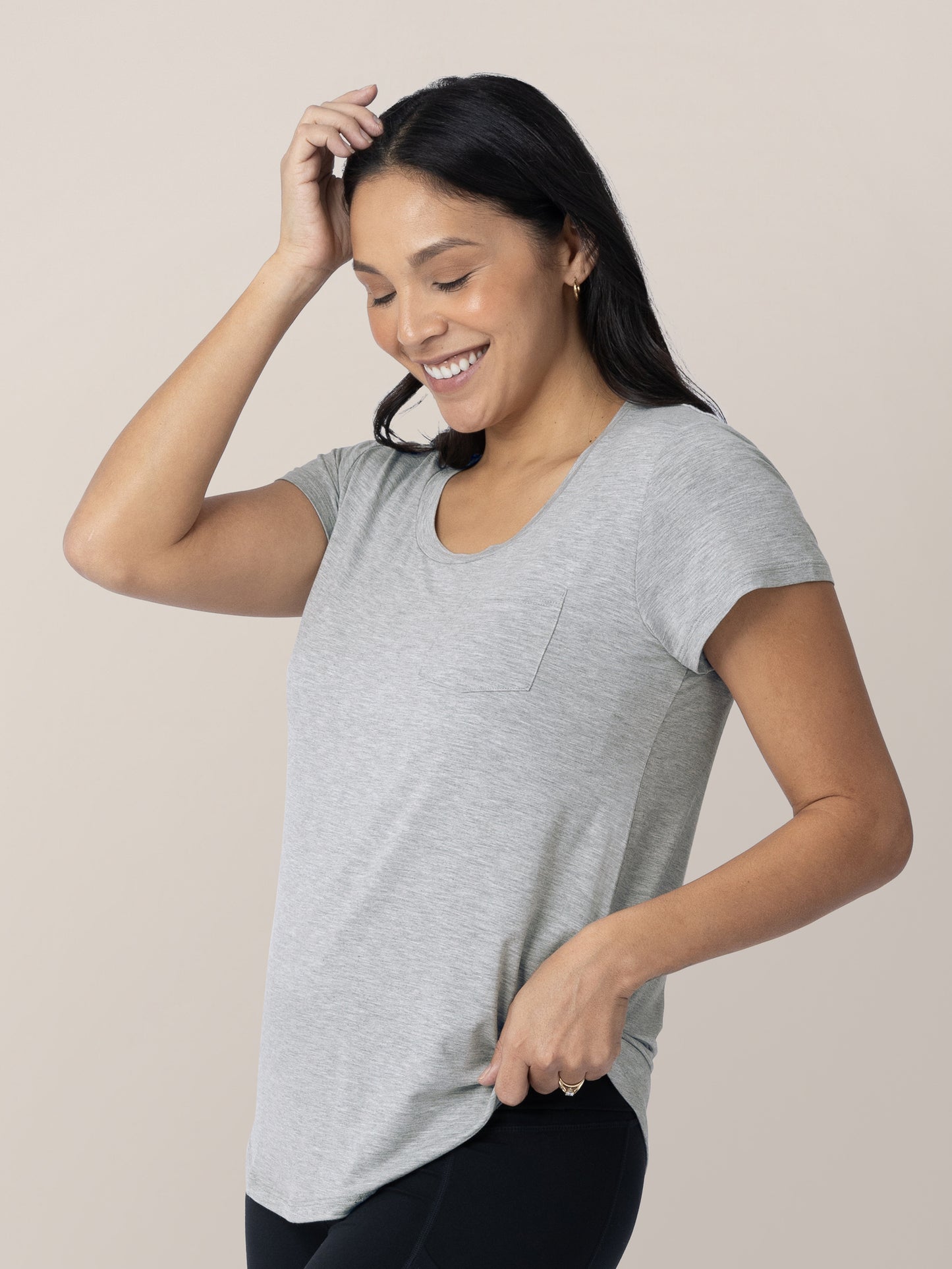 Model wearing the Everyday Maternity & Nursing T-shirt in Grey Heather with her hand on her head and hip.  @model_info:Julana is wearing a Small.