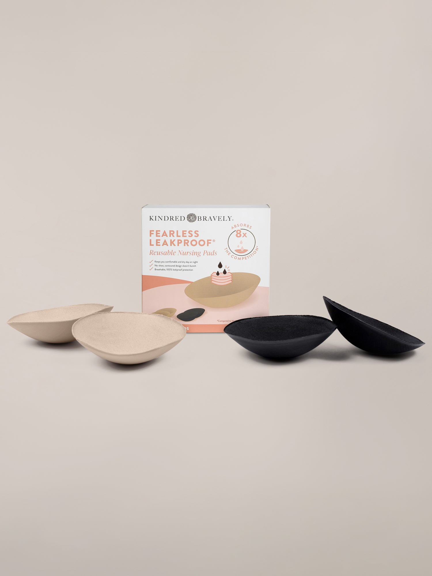 Flat lay image showing the Fearless Leakproof® Reusable Nursing Pads in Black & Beige against an off white background. 