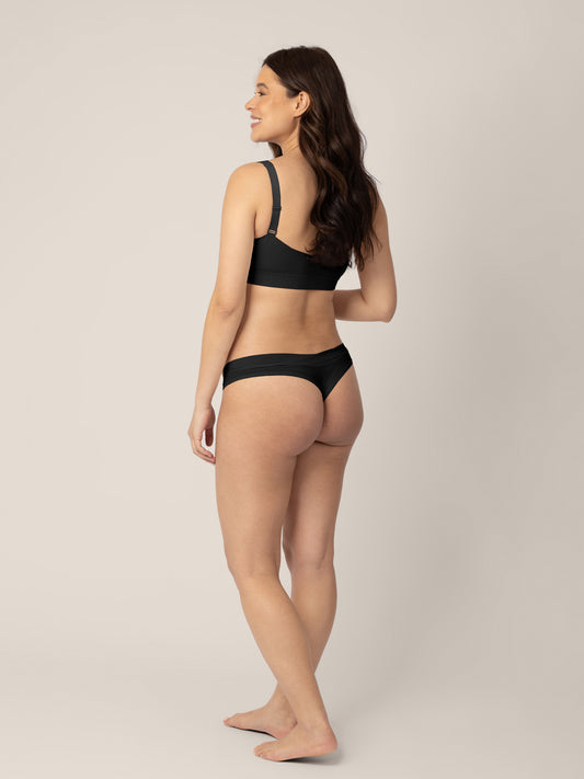 Back of a model wearing the Grow with Me™ Maternity & Postpartum Thong in Black @model_info:Vanessa is wearing a Small.