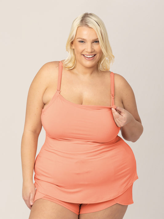 Front view of model wearing the Bamboo Lounge Around Nursing & Maternity Tank in vintage coral, and showing unclipping feature @model_info:Lauren is wearing a 1X.