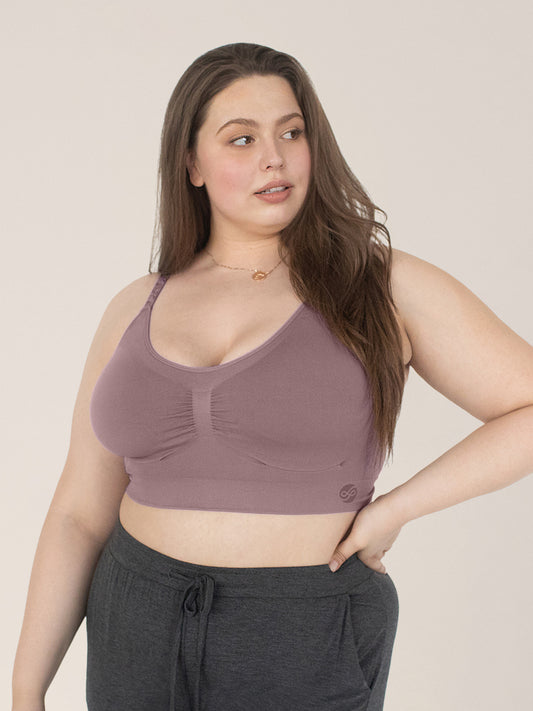 Model wearing the Nellie Sublime® Wireless Bra in Twilight with her hand on her hip. @model_info:Bailey is wearing an X-Large Busty.