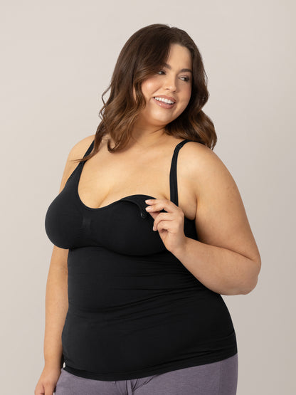 Model wearing the Simply Sublime® Maternity & Nursing Tank in Black showing the easy clip down nursing access. @model_info:Bailey is wearing an X-Large. 