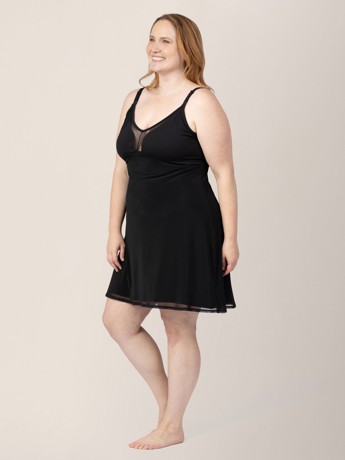 Front/side view of model wearing the Aurora Mesh Nursing Nightgown in black.