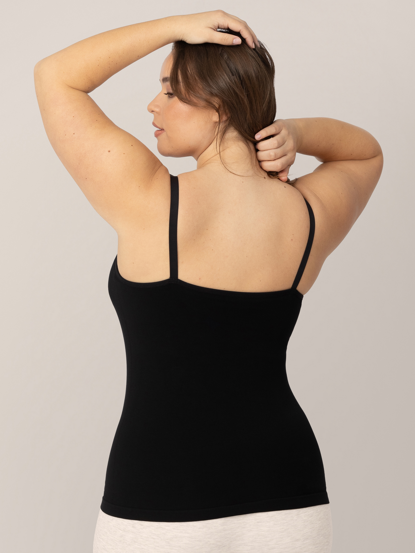 Back view of a model wearing the Sublime® Bamboo Maternity & Nursing Camisole in Black