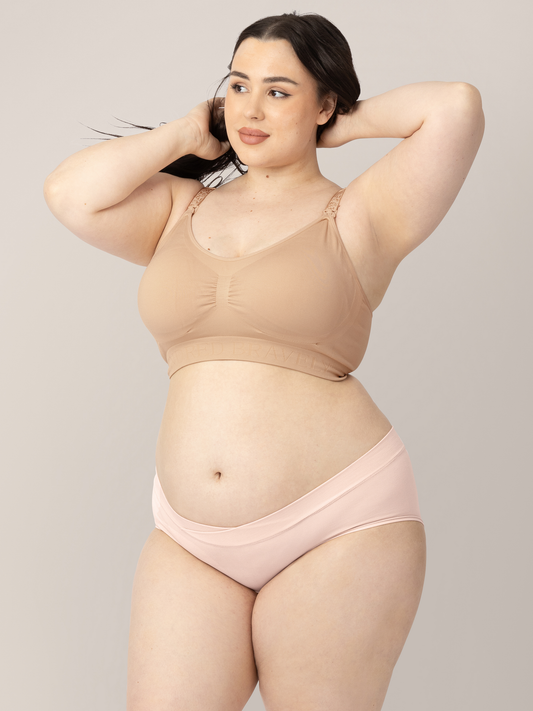 Front view of a model wearing the Bamboo Maternity & Postpartum Hipster in Soft pink. @model_info:Rachel is wearing an X-Large.
