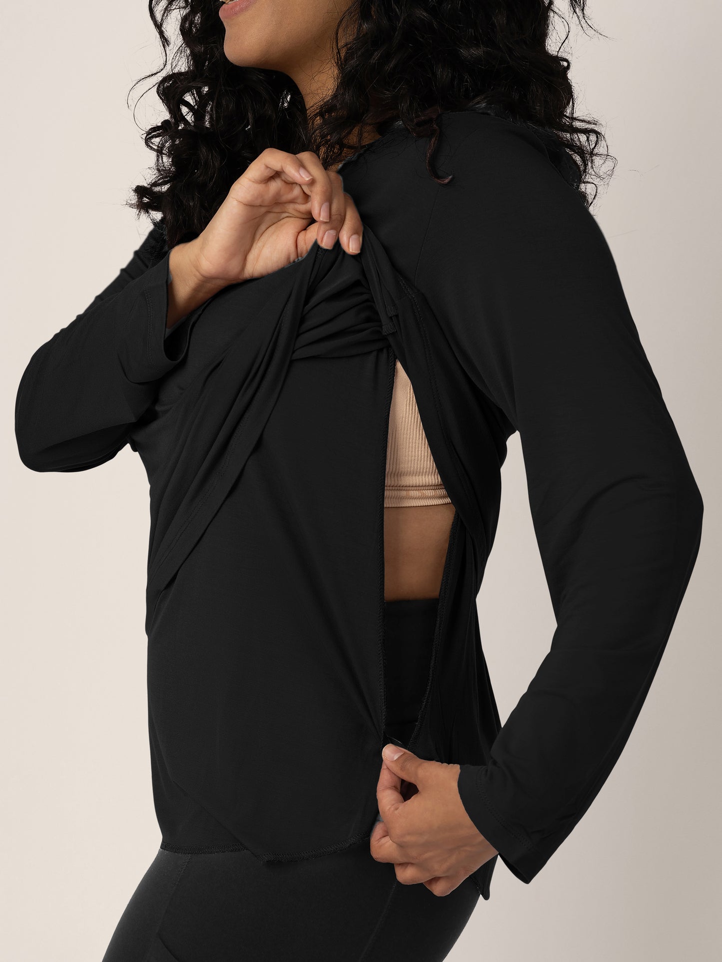 Model wearing the Bamboo Maternity & Nursing Long Sleeve T-Shirt in Black showing the easy pull up nursing access.