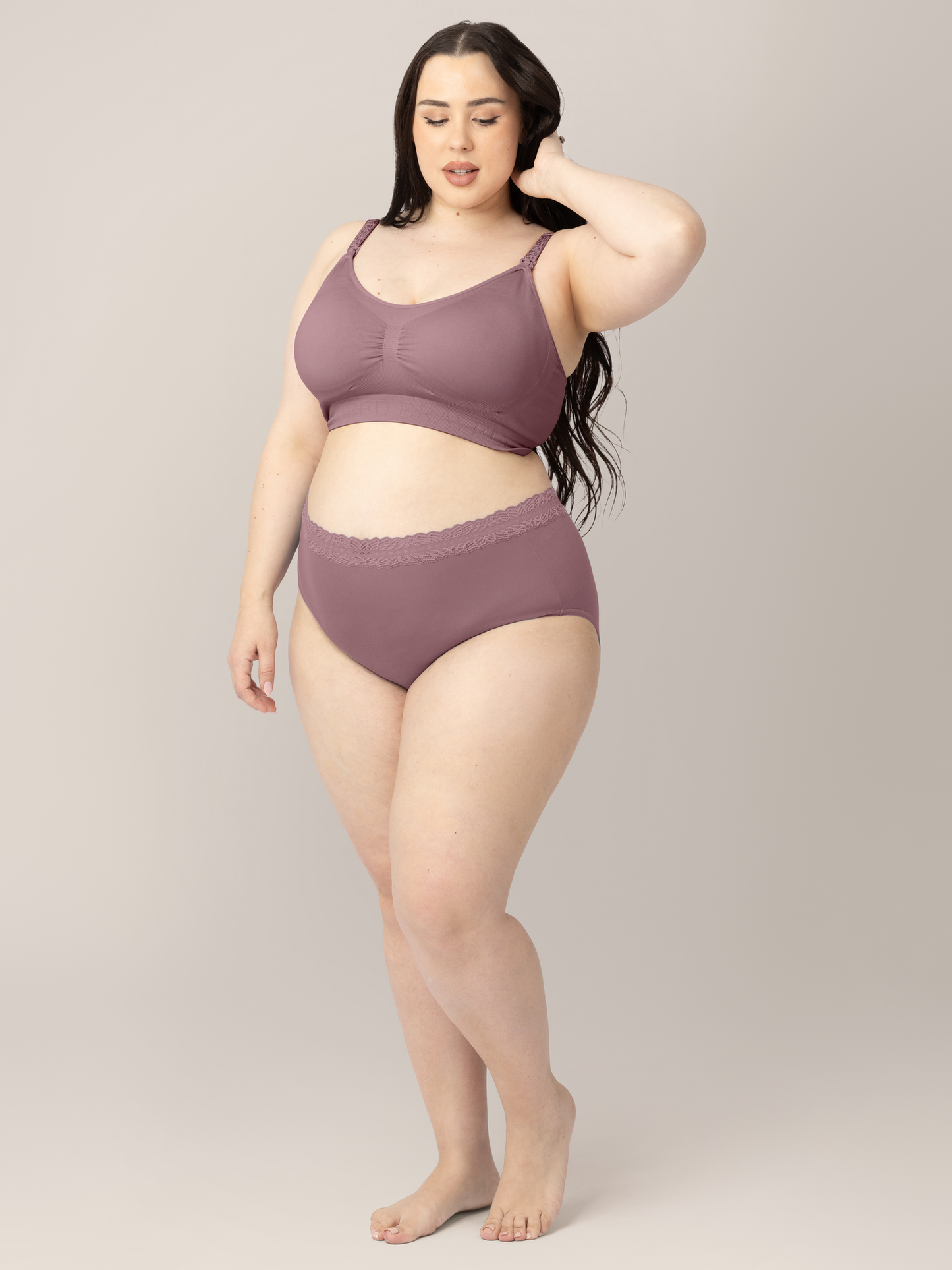 Model with her hand in her hair wearing the High Waisted Postpartum underwear in Dusty Hues. 
