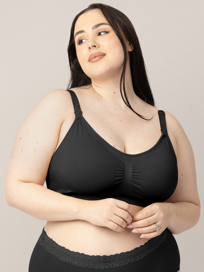 Model wearing the Simply Sublime® Nursing Bra in Black with her hands on her stomach. 