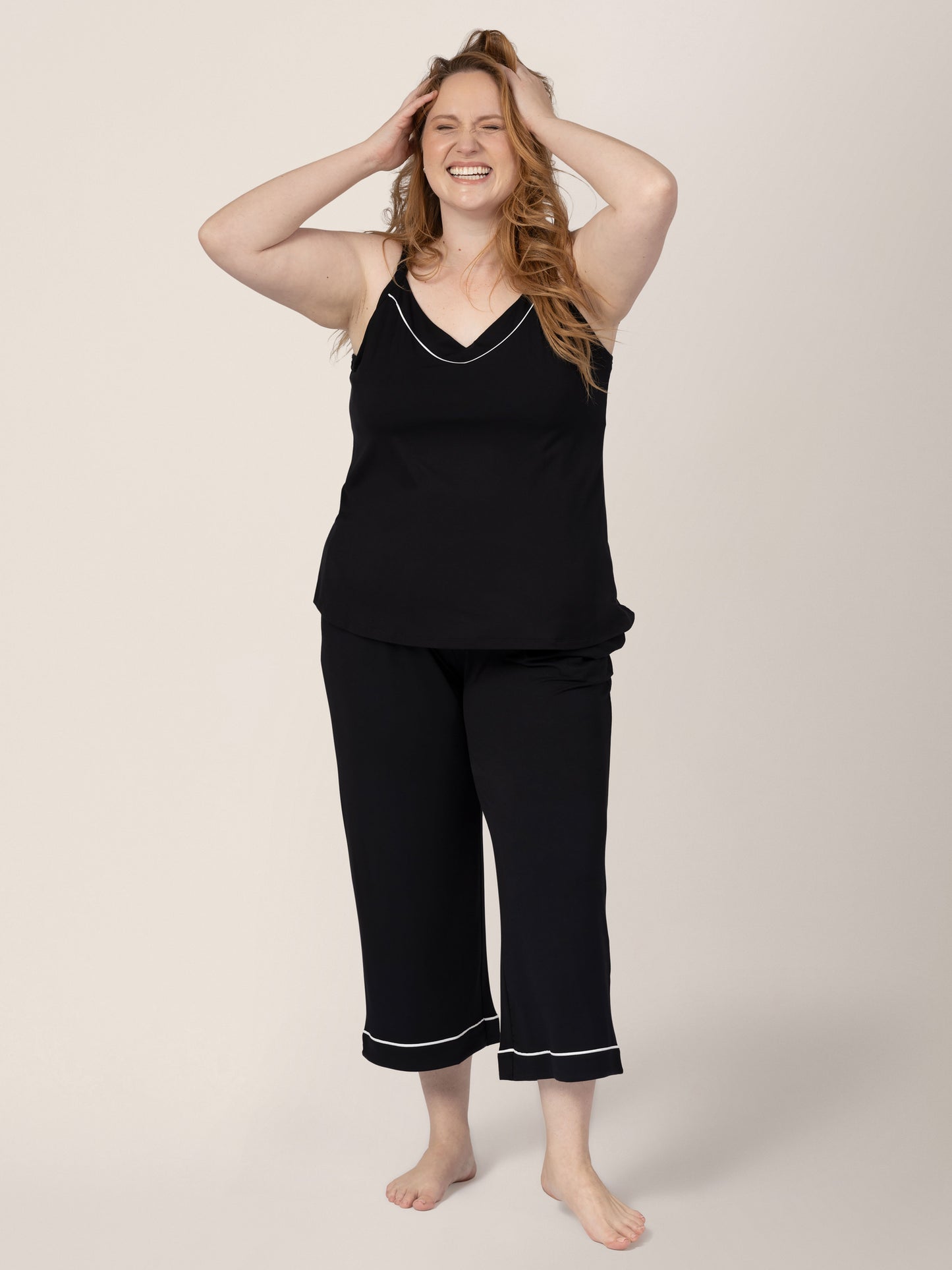Front view of a model wearing the Clea Bamboo Nursing Tank & Capri Pajama Set in Black