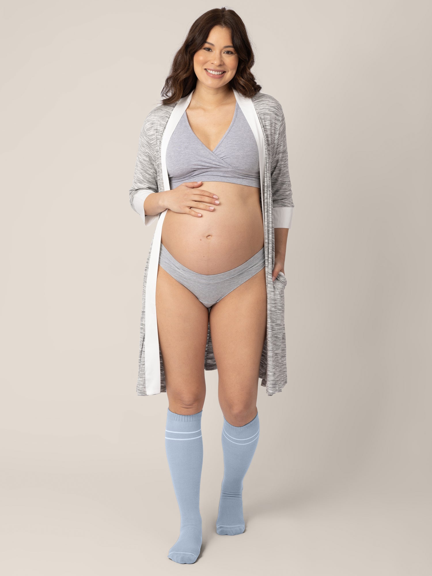 Pregnant model wearing the Premium Maternity Compression Socks in Stone Blue.