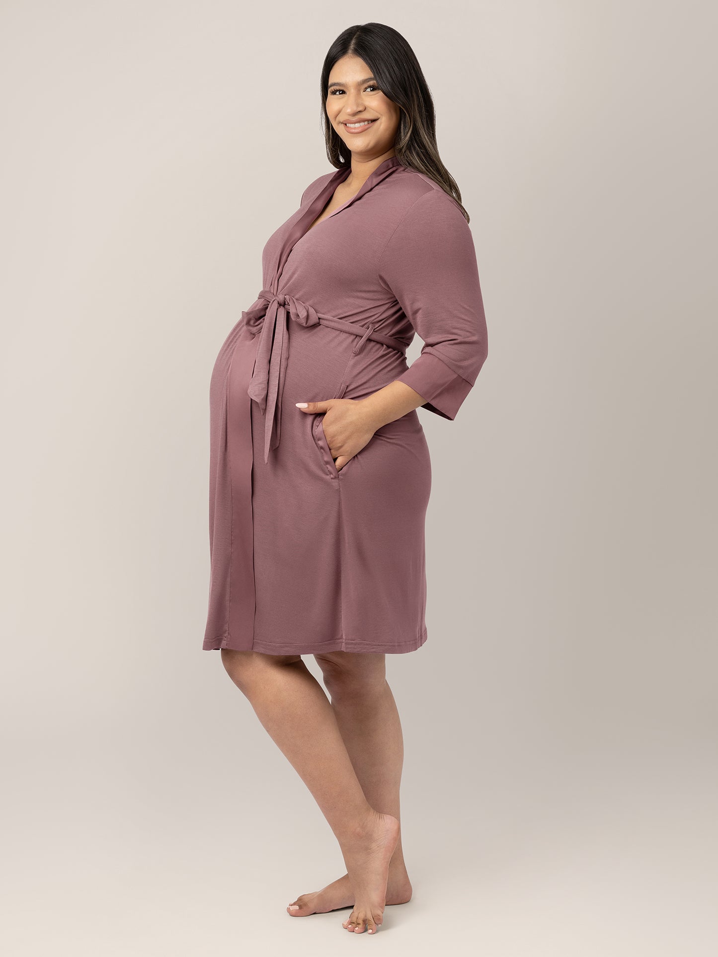 Side view of a pregnant model wearing the Emmaline Robe in Twilight