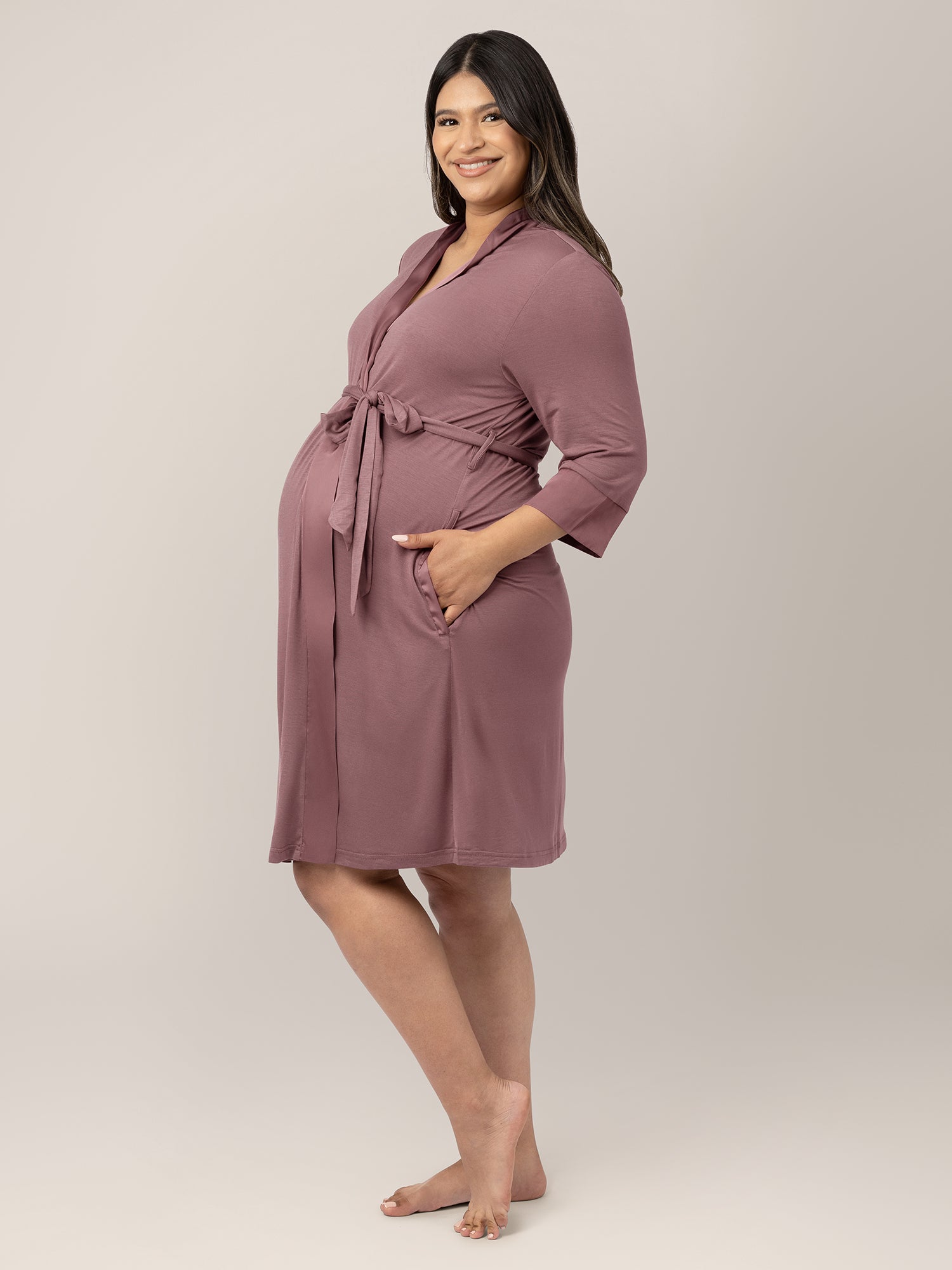 Side view of a pregnant model wearing the Emmaline Robe in Twilight