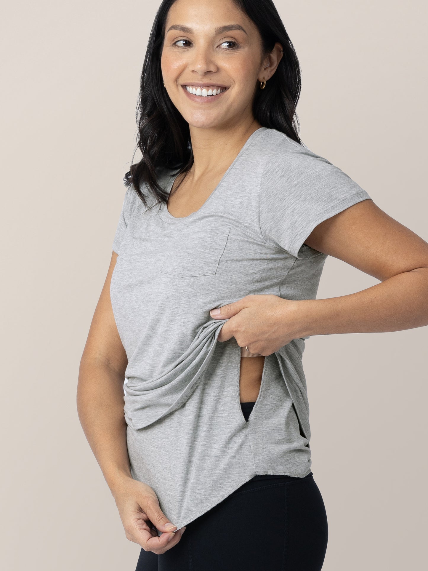 Model wearing the Everyday Maternity & Nursing T-shirt in Grey Heather showing the easy pull aside nursing panel.