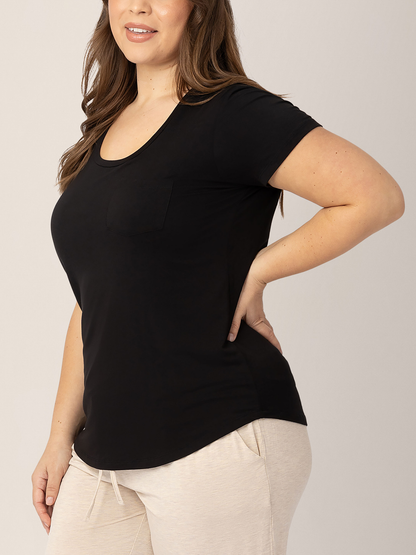 Model wearing the Everyday Maternity & Nursing T-shirt in Black with pockets with her hand on her hip.