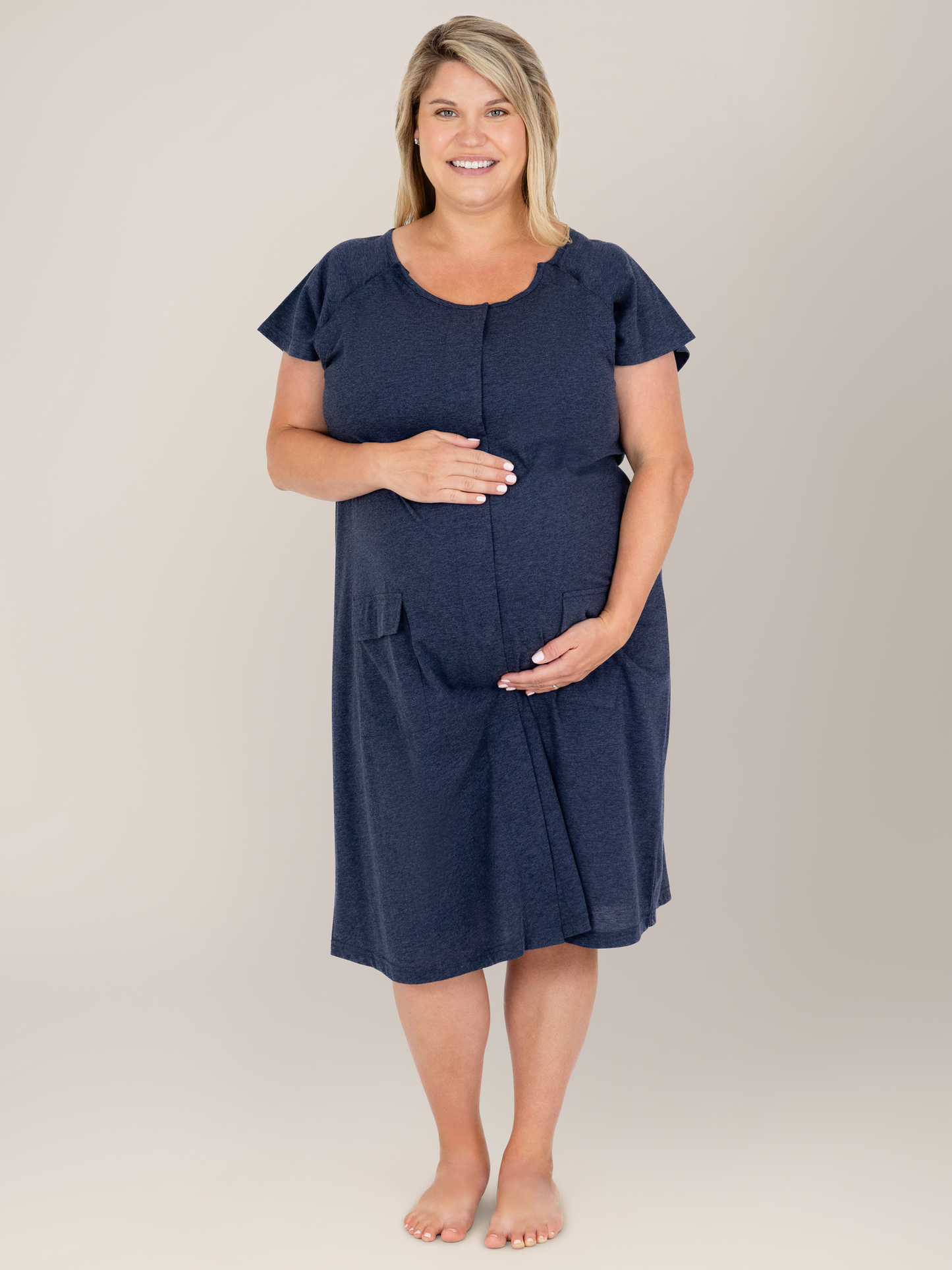 Front view of a pregnant model wearing the Universal Labor & Delivery Gown in Navy Heather