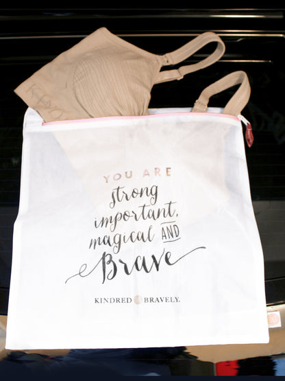 Picture of the Mesh lingerie Laundry Bag with a quote on it and a bra hanging out.