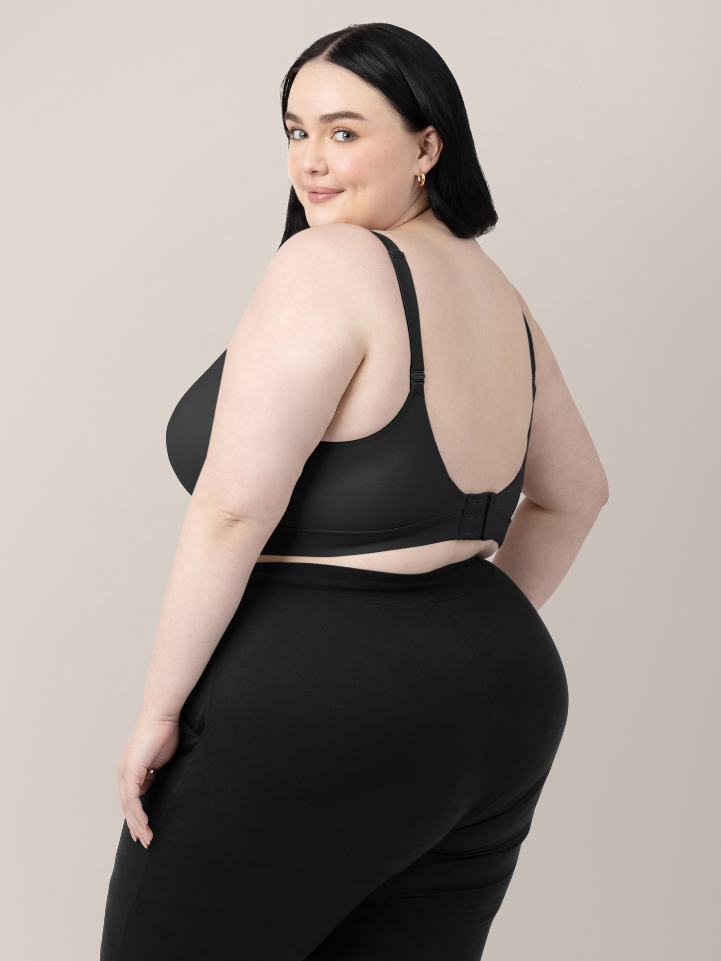 Back of a model wearing the Minimalist Hands-Free Pumping & Nursing Bra in Black.