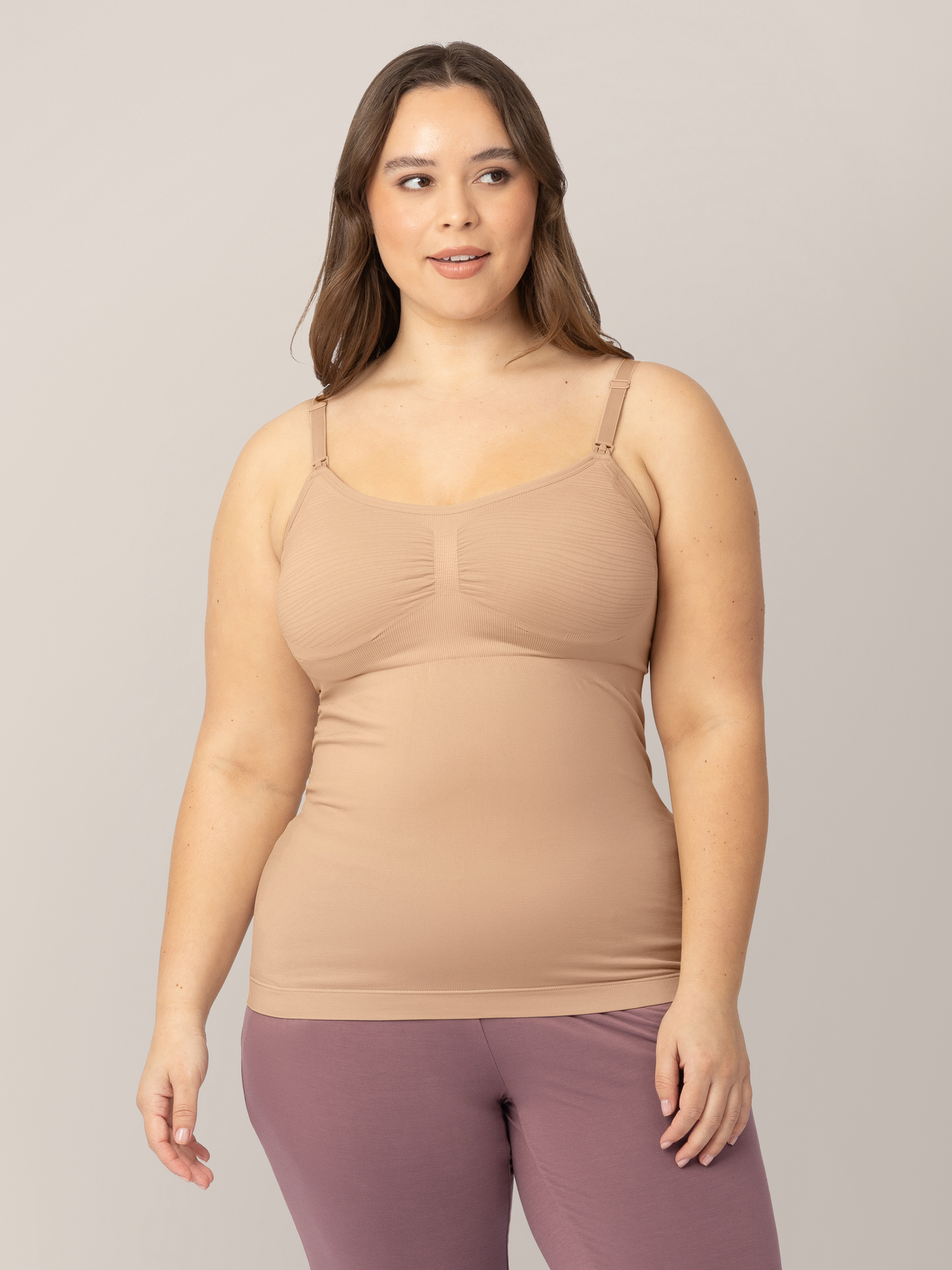 Model wearing the Sublime® Hands-Free Pumping & Nursing Tank in Beige with her hands at her sides.