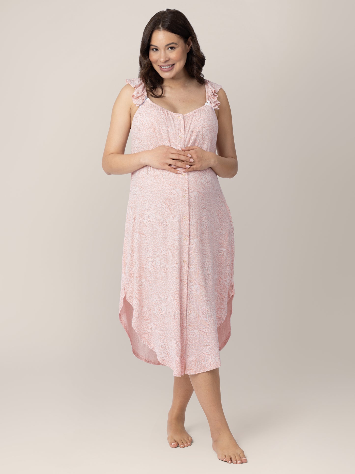 Front view of a pregnant model wearing the Ruffle Strap Labor & Delivery Gown in Pink Hydrangea.