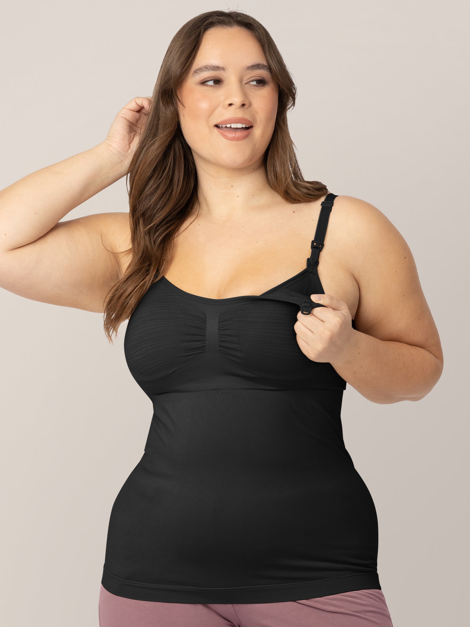 Model showing the clip down pumping access on the Sublime® Hands-Free Pumping & Nursing Tank in Black