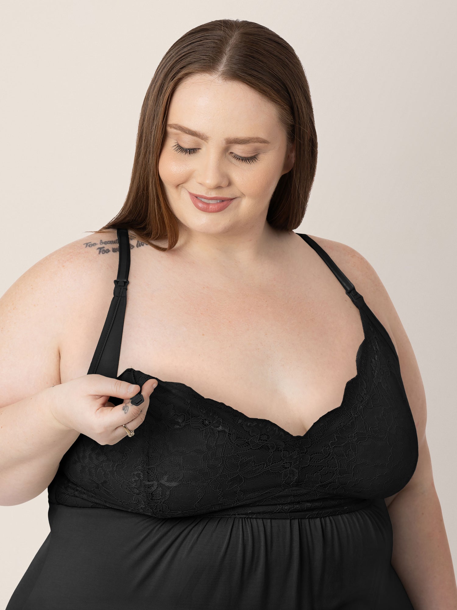 Closeup of a model wearing the Lucille Maternity & Nursing Nightgown in Black showing the easy clip down nursing access.