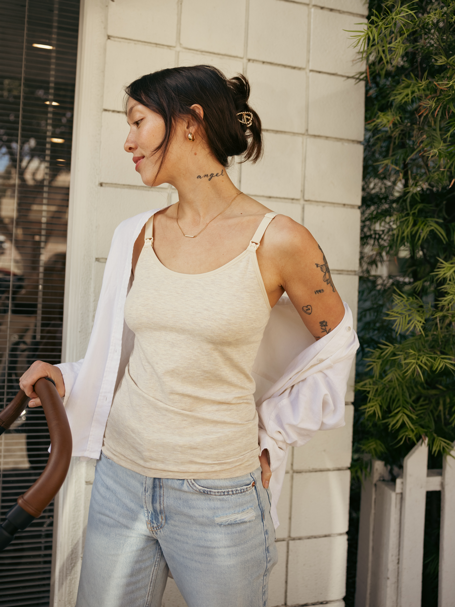 Model outside with stroller, wearing the Sublime® Bamboo Maternity & Nursing Camisole in oatmeal heather. @model_info:Lyn is wearing a Small.