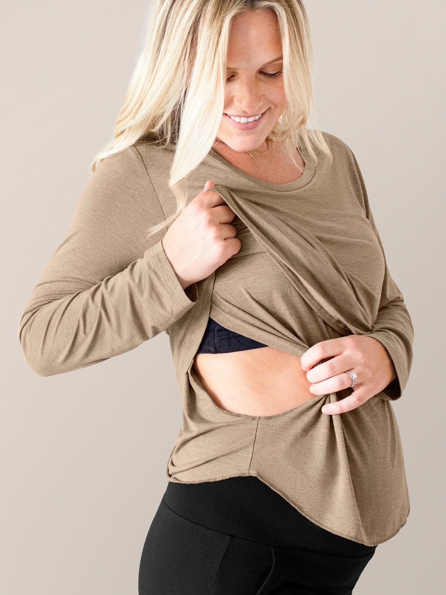 Model wearing the Bamboo Maternity & Nursing Long Sleeve T-shirt in Wheat holding up the nursing panel.