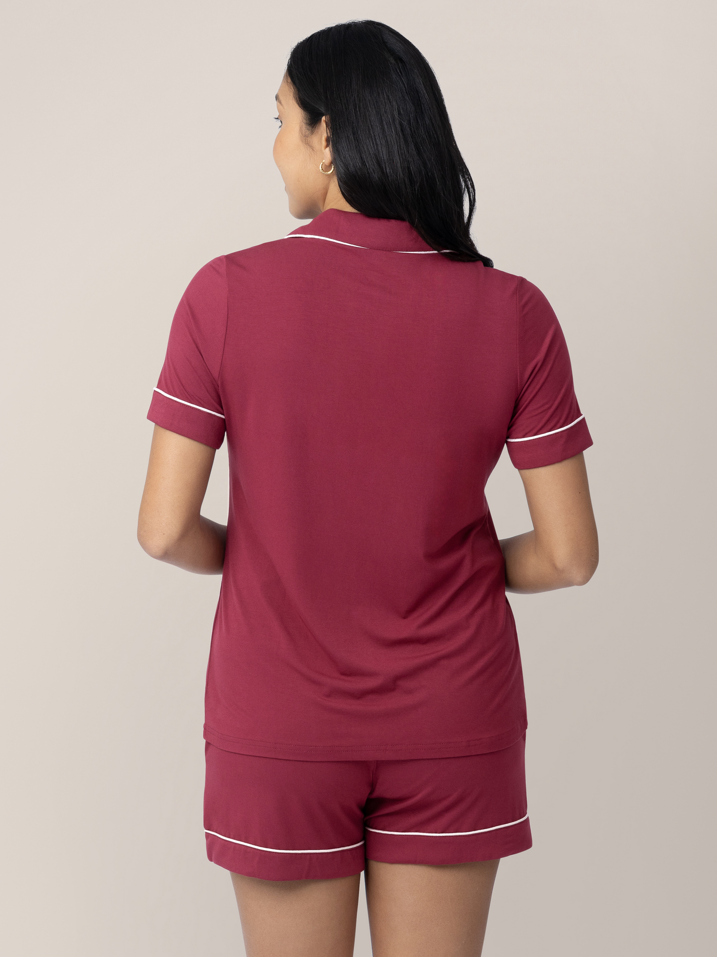 Back of a model wearing the Clea Bamboo Short Sleeve Pajama Set in Deep Berry
