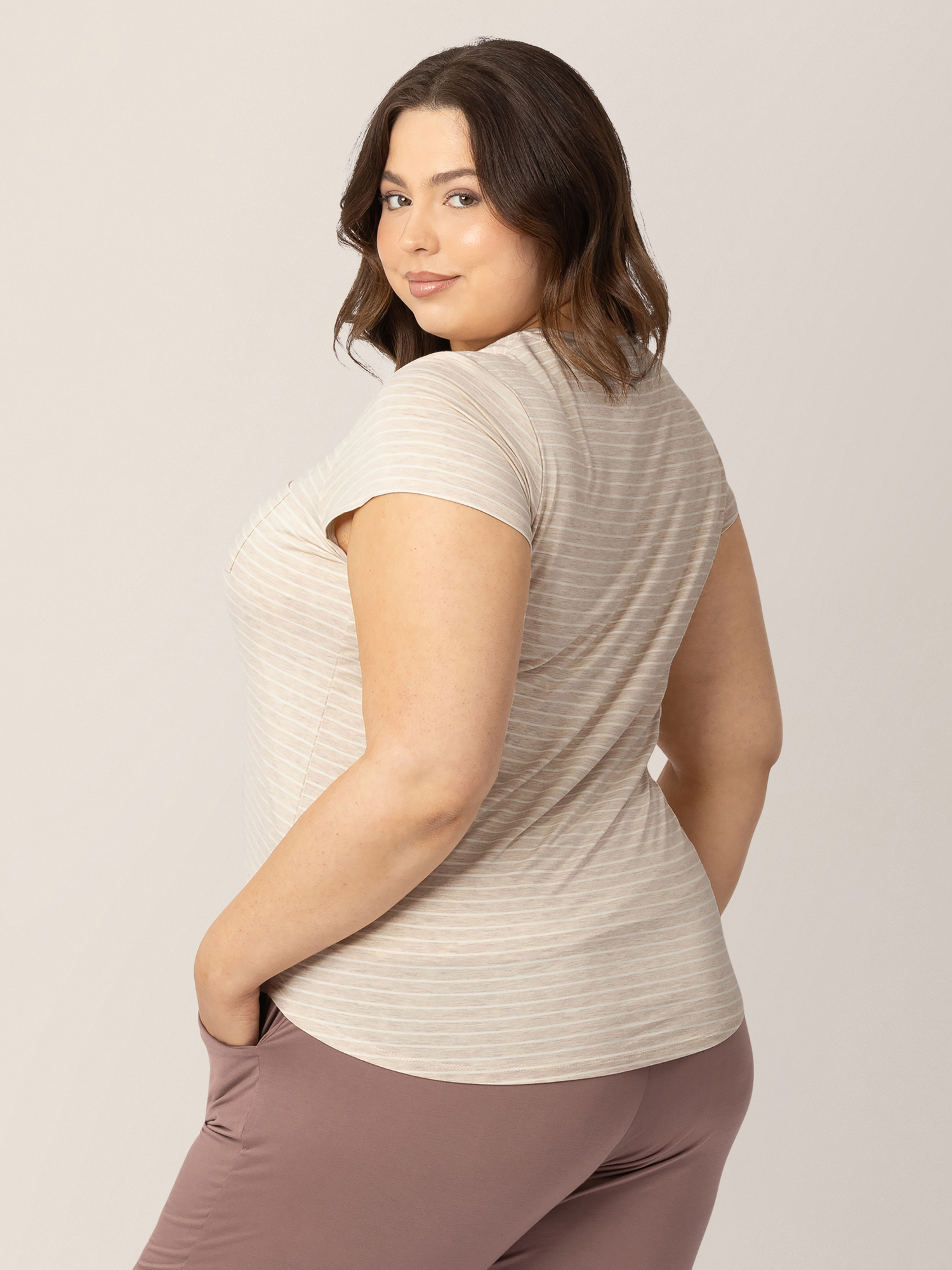 Side view of a model wearing the Everyday Maternity & Nursing T-shirt in Oatmeal Stripe