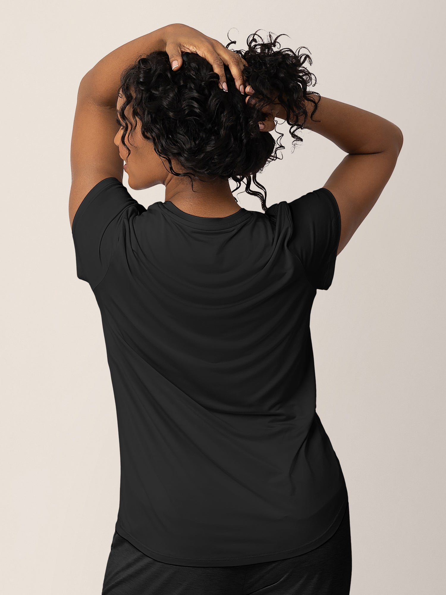 Back of a model wearing the Everyday Maternity & Nursing T-shirt in Black