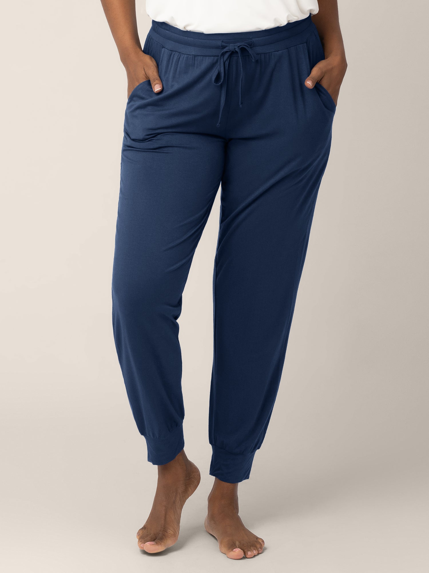 Bottom half of a model wearing the Everyday Lounge Jogger in Navy @model_info:Rashé is 5'6" and wearing a Small Regular.