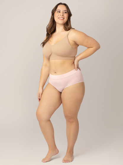 Model wearing the Grow with Me™ Maternity & Postpartum Brief |in Beige with one hand on her hip. 