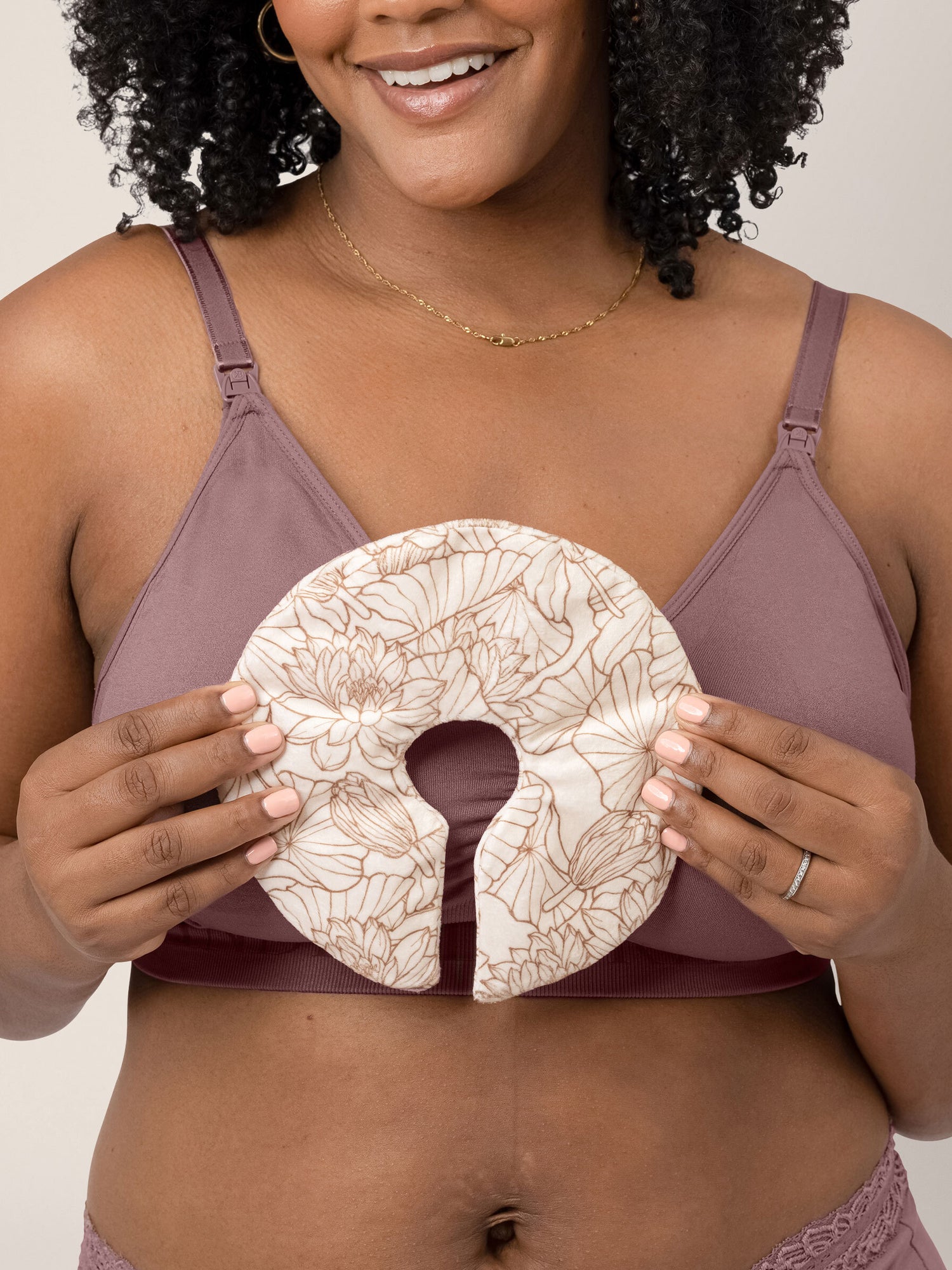 Model holding the Soothing Nursing Gel Pack in front of her