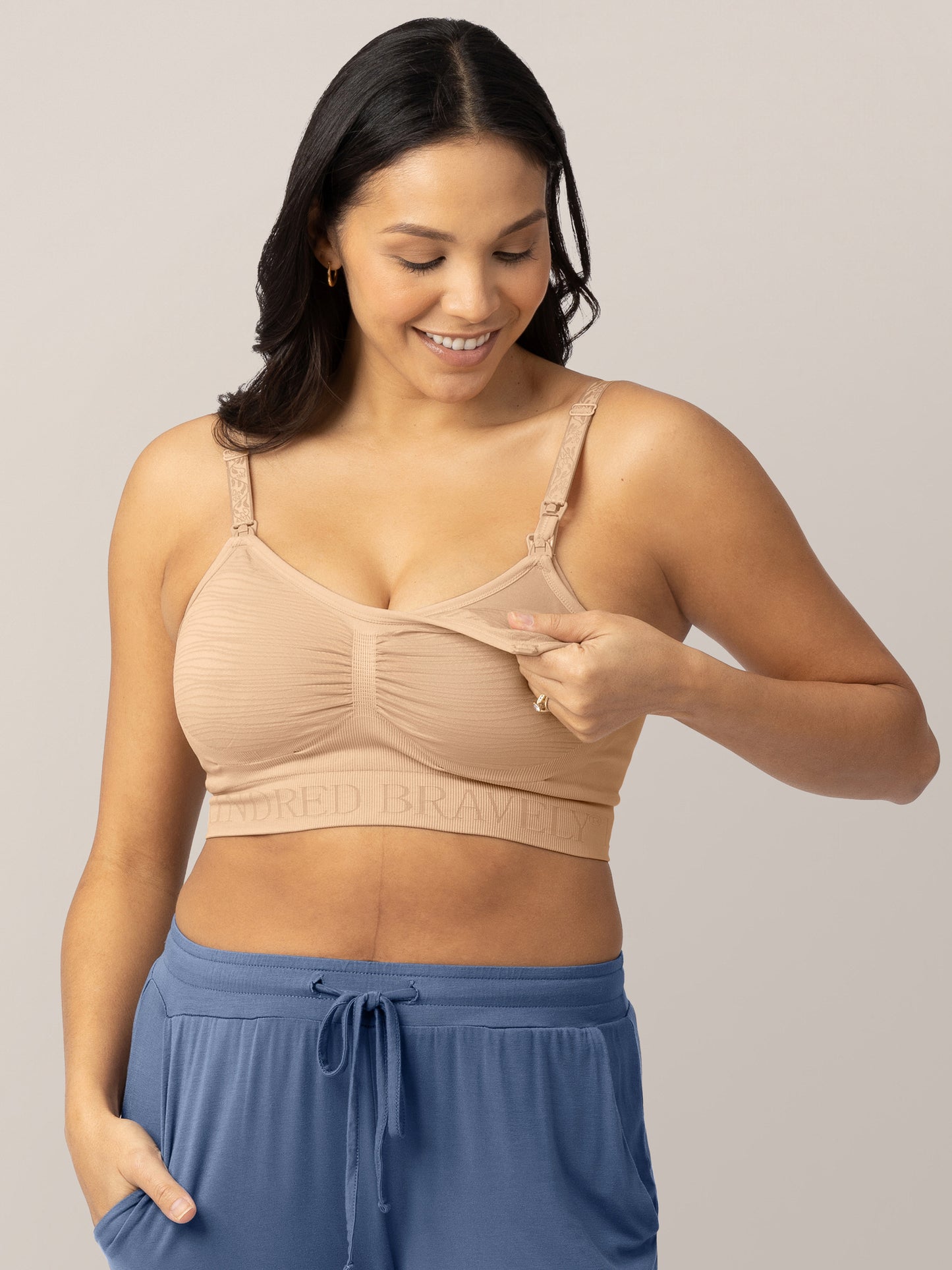 Model wearing the Sublime® Hands-Free Pumping & Nursing Bra in Beige showing the clip down nursing and pumping access