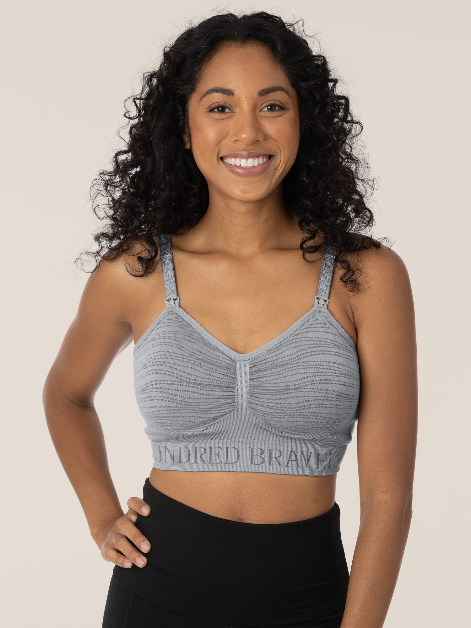 Front view of the top half of a model wearing the Sublime® Hands-Free Pumping & Nursing Bra in Grey