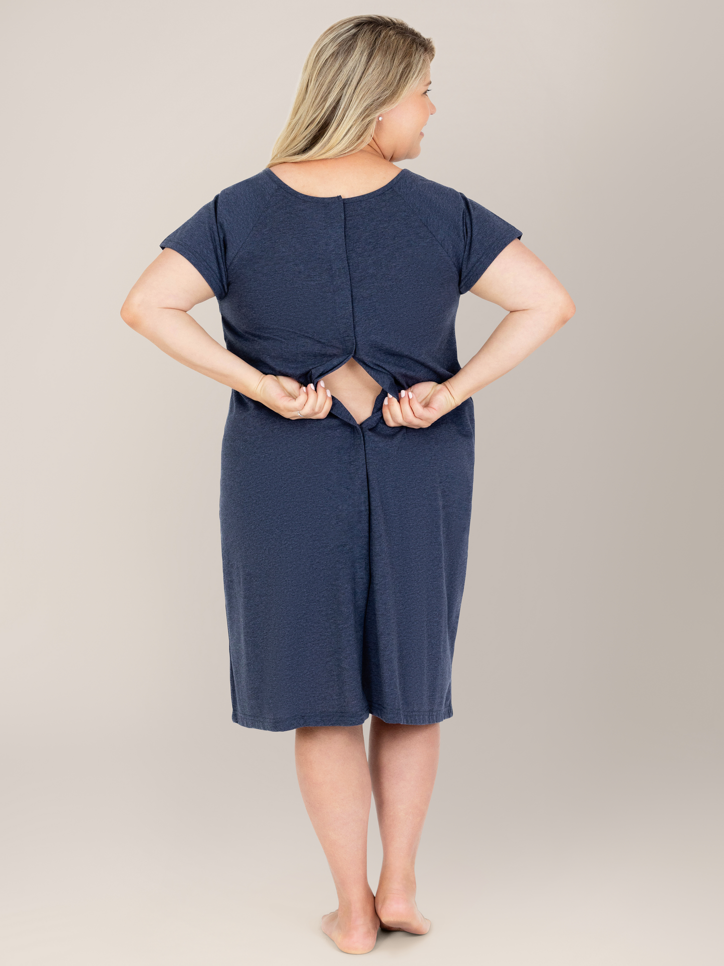 Back view of a pregnant model showing the easy back access on the Universal Labor & Delivery Gown in Navy Heather