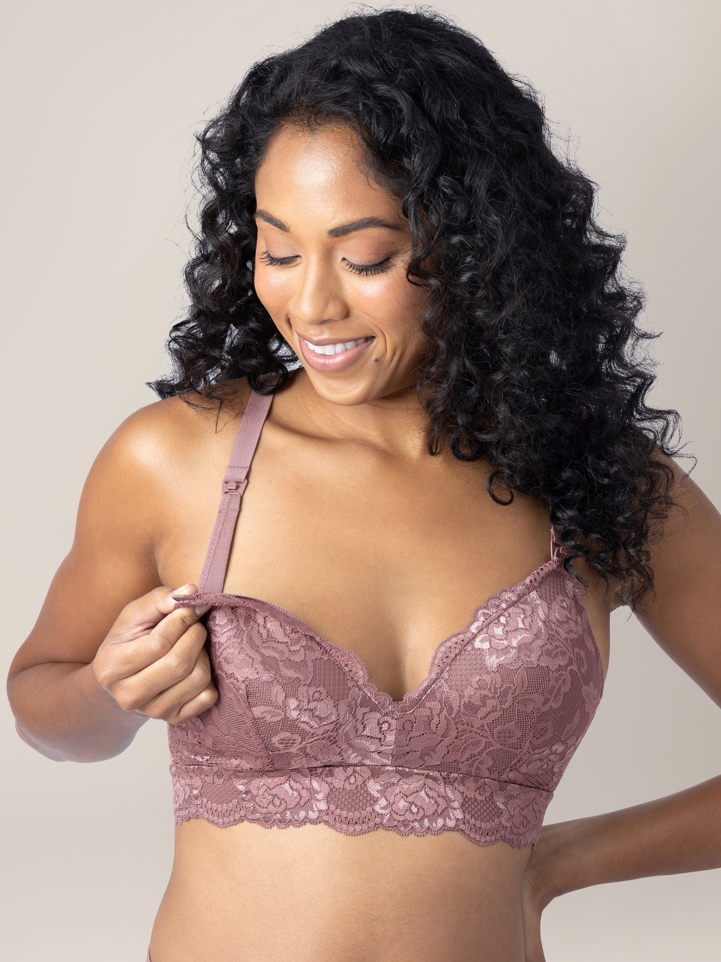 Model wearing the Lace Minimalist Nursing & Maternity Bra in Twilight showing the clip down access.@model_info:Anastacia is wearing a Small.