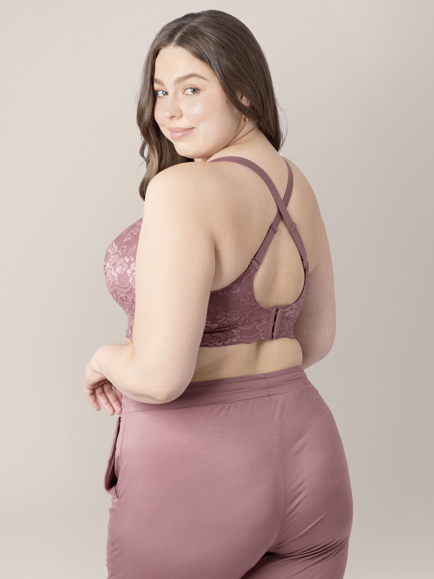 Back of a model wearing the Lace Minimalist Hands-Free Pumping & Nursing Bra in Twilight showing the crossed over back.@model_info:Bailey is wearing an X-Large Busty.